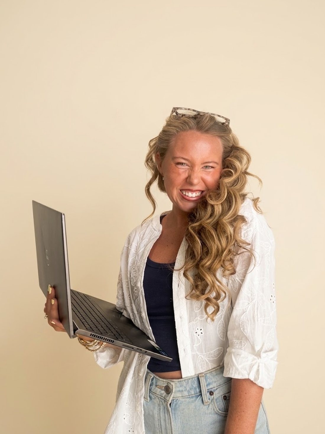 Avery Leanne Fox laughing with her laptop